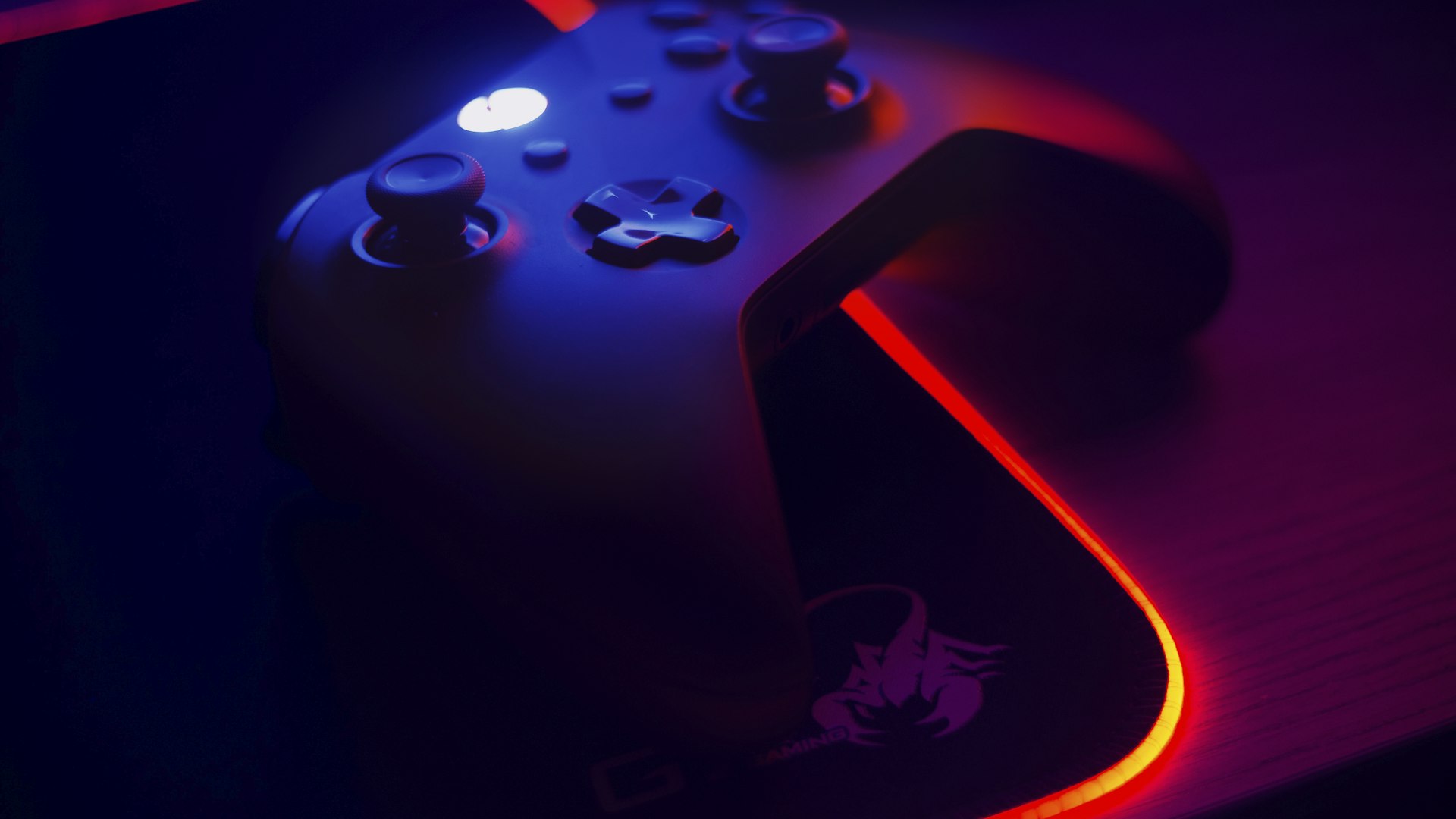 Gaming setup lit in neon colours